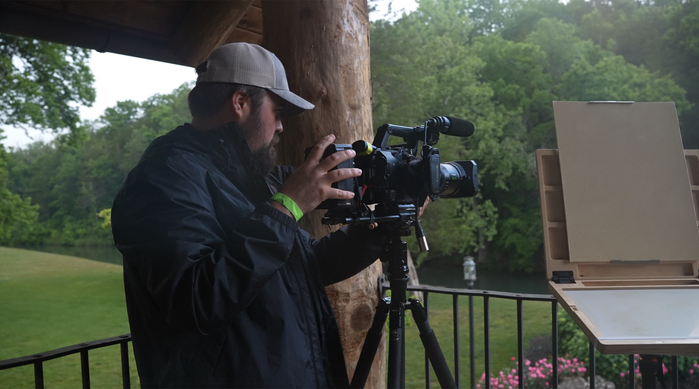 Arron operating a cinema camera during an outdoor PACE artist demonstration